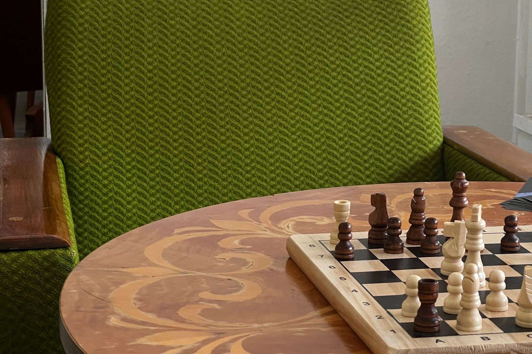 Chess set displayed on a wooden table in a home interior