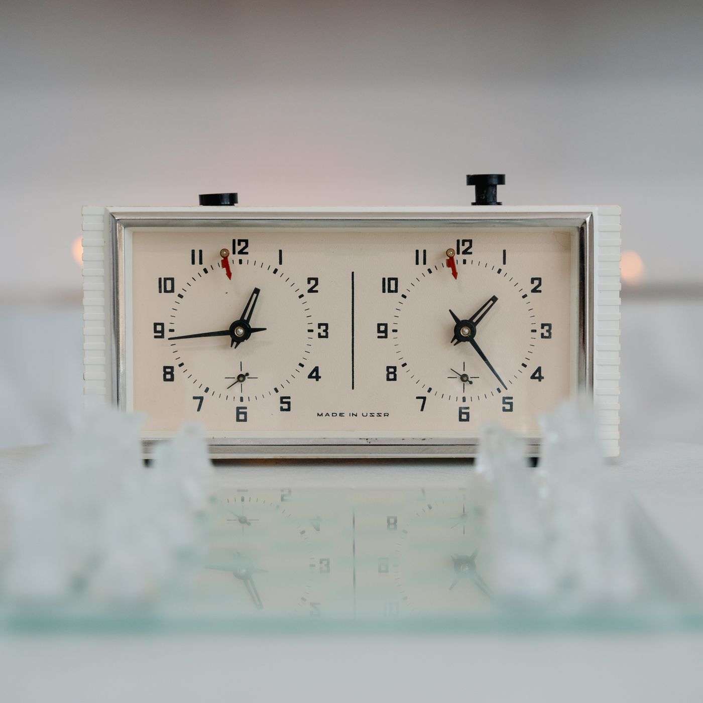 Illustrative timed chess scene; exact product photographs appear first